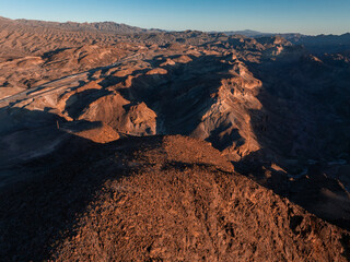 Hoover Dam on the Colorado River straddling Nevada and Arizona at dawn from above. Aerial view of...