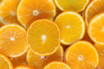 juicy tangerines cut into circles as a background 5