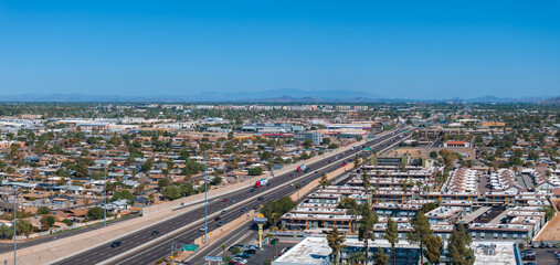 Fototapeta premium Phoenix city downtown skyline cityscape of Arizona in USA. Top view of downtown Phoenix Arizona on a summer day in USA.