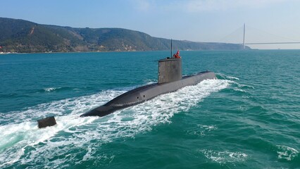 Navy submarine underway on calm waters waving the Turkish flag. Ships of impartial states can pass...
