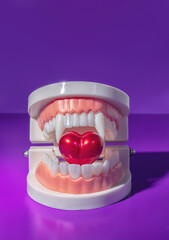 A Vampire Mouth Biting Into a Red Heart, Taking a Bite Out of Love Concept