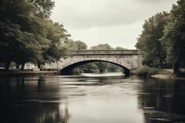Fototapeta na wymiar Bridge and a river in a city with a grayscale filter Ai Generative
