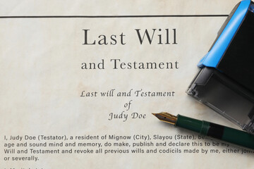 Last Will and Testament with fountain pen and stamp, top view
