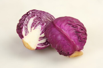 Sliced and of Purple Cabbage Vegetable on White Table