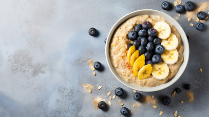 Obraz na płótnie Canvas breakfast oatmeal porridge with banana blueberries