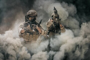 Military soldier between smoke and dust in battlefield	 - obrazy, fototapety, plakaty