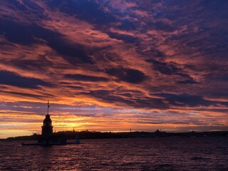 sunset over the sea at maiden’s tower in istanbul turkey