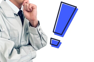 作業服を着た作業員の男性が驚く