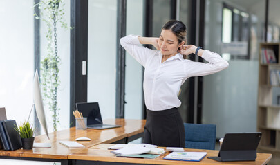 Young Asian businesswoman Exhausted lady with sleeply eye at workplace,