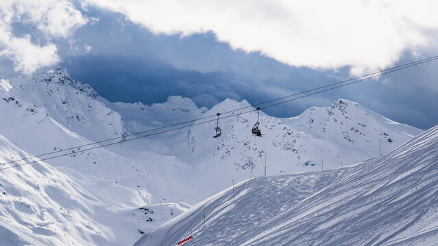 Chairlifts cutting through the mountains