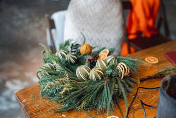 A young lady joins a workshop to create festive Christmas ornaments.