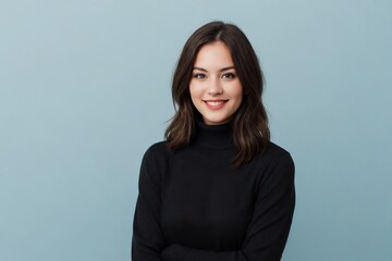 Obraz premium Attractive woman wearing a black turtleneck sweater is standing against the blue background with copy space.