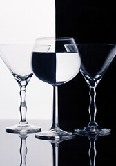 Three wine glasses isolated on black and white splited background - 707520993