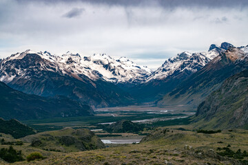 Fototapeta na wymiar Mountains with snow and a Valley
