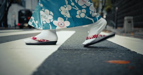 Japanese woman, feet and walking in kimono in city, journey and wellness for heritage by outdoor. Person, steps and traditional clothes in tokyo for holiday and pedestrian crossing in japan fashion