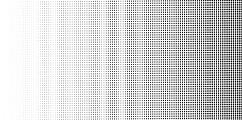 Halftone dotted texture grunge background. Abstract black and white halftone dotted background.