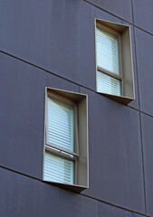 Abstract image of windows and window hoods in a modern apartment building. Providing protection from the elements