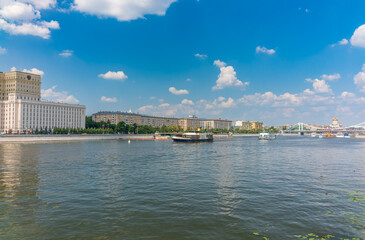 Naklejka premium Cruise ship sails on the Moscow river in Moscow city center, popular place for walking.