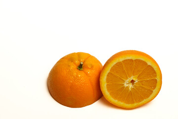 closeup of a fresh orange cut in half isolated on white background and copy space