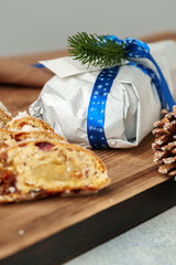 Christmas stollen on wooden cutting board close up