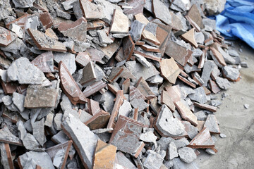 Piles of broken floor tiles from house renovations