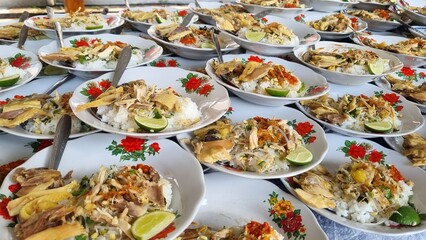 Stack of plates chicken Soto or Soto Ayam in Indonesia, traditional hot chicken soup. Soto ayam is...