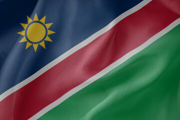 Obraz premium Namibia waving flag close up fabric texture background