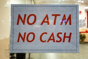 Palermo, Sicily, Italy A sign at a bank window says: No ATM No Cash.