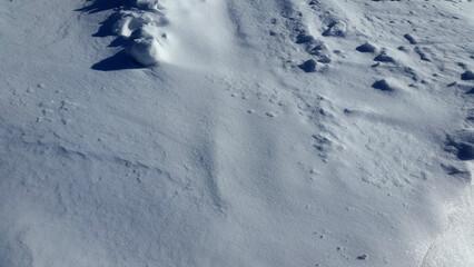 Fototapeta na wymiar Snowy plain. Snow surface. Winter snowy landscape