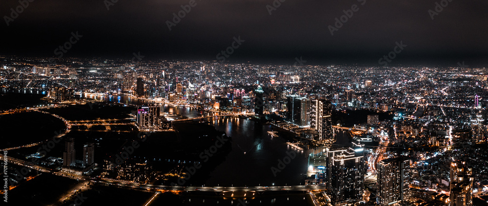 Poster Aerial drone photo - Skyline of Saigon (Ho Chi Minh City) at night. Vietnam