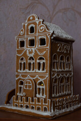 The hand-made eatable Christmas gingerbread house from ginger cookies.