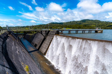 Water uniformly flowing down in the beautiful dam in nearly perfect weather