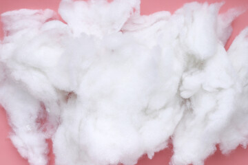 Polyester stable fiber on pink background.