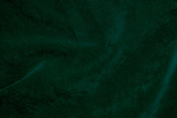 Obraz na płótnie Canvas Dark green velvet fabric texture used as background. Emerald color panne fabric background of soft and smooth textile material. crushed velvet .luxury emerald tone for silk...