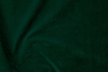 Dark green velvet fabric texture used as background. Emerald color panne fabric background of soft...