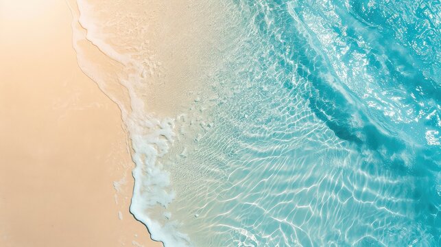 sand beach from above with light blue transparent water wave and sun lights, summer vacation background concept banner with copy space, natural beauty spa outdoors.
