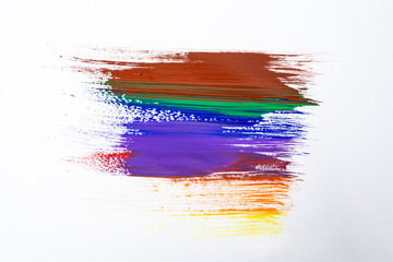 Rainbow colors smudge painted with a single brush stroke, isolated on white background