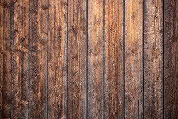 Dark brown wooden boards wall, weathered wood backdrop, abstract texture