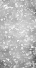  Glowing silver white bokeh with hearts vertical illustration background.