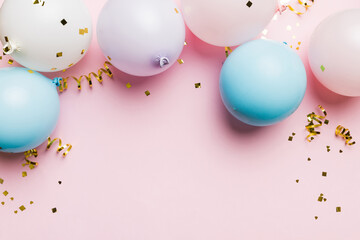Background with fastive air balloons of round shape and confetti, multicoloured top view. Birthday...