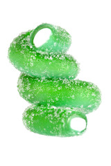 Levitation of green jelly candy strip in sugar sprinkles isolated on transparent background.