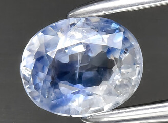 natural blue sapphire gem on the background