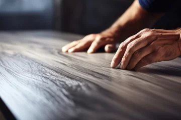 Foto op Aluminium Worker hands installing wooden laminate floor © Michael