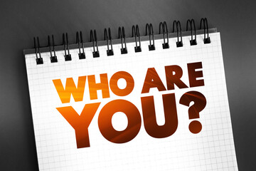 Who Are You question text quote on notepad, concept background