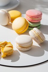 Sweet and colourful french macaroons or macaron on a light background