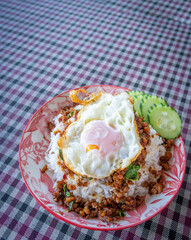 Thai food, stir-fried basil with pork and fried egg Popular food of Thailand, original Thai food concept.