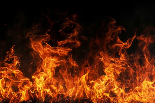 A blazing fire burns against a black background