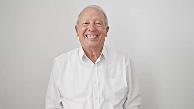 Confident and cheerful senior man with grey hair, wearing a shirt, standing tall. he's grinning a toothy smile, exuding a positive attitude. all set against a clean white, isolated background.