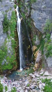 Aerial drone view of the waterfall in Theth national park, Albania. Approaching the waterfall