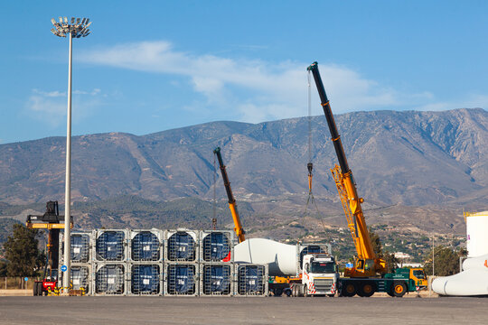 Motril, Spain - 09.20.2023: Vestas wind turbine blades are loaded onto a cargo truck in the seaport of Motril in Spain.